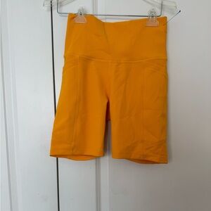 Women’s High-Rise Bike Shorts in Mustard Yellow size medium